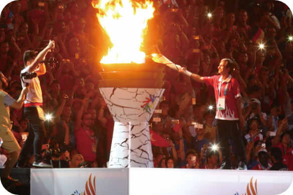 Photo of the Deaflympics cauldron with flames rising