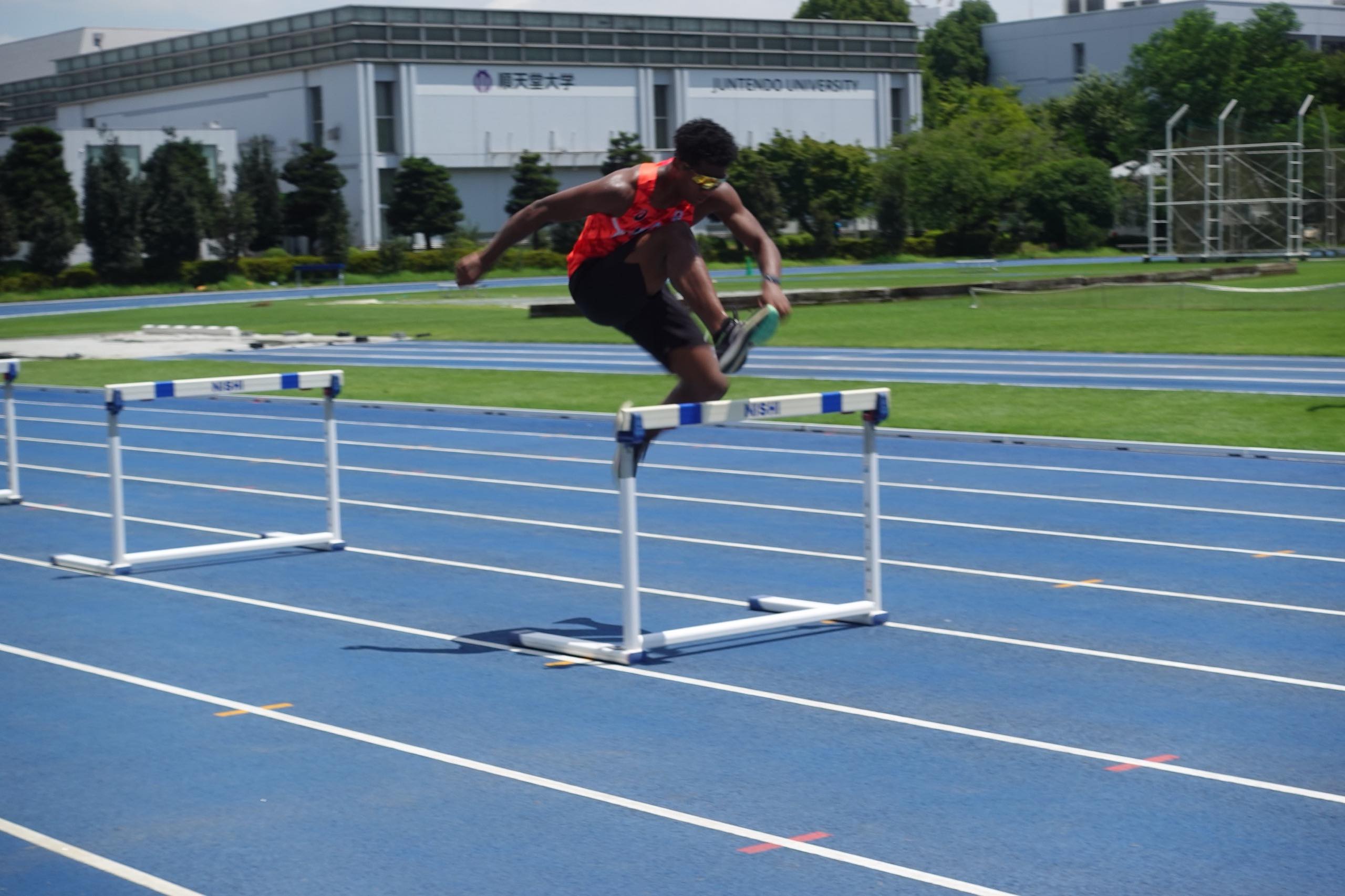 The photo of Muratake jumping hurdles